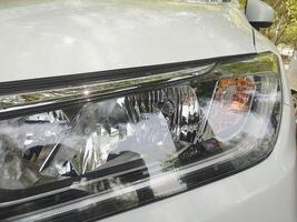 Closeup view of Car Head light with turn signal in it photo