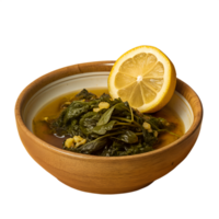 A bowl of freshly cooked spinach in broth with a half lemon slice on top, placed in a wooden bowl on a white background. png