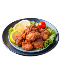A delicious plate of crispy fried chicken served with fresh lemon slices and a cherry tomato on a bed of lettuce. png