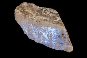 Macro of a stone Moonstone mineral on a black background photo