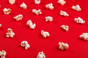 popcorn macro on a red background photo