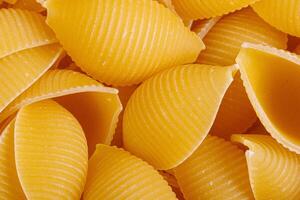 Pasta products in the form of a shell, texture photo