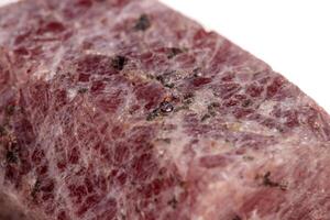 Macro mineral stone Ruby in the breed a white background photo