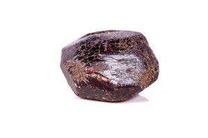 Macro of a mineral garnet stone on a white background photo