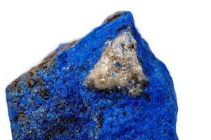Macro Azurite mineral stone with Pyrite inserts on a white background photo