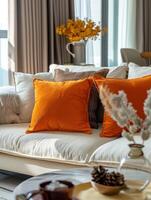 Cream Sofa With Orange Pillows in a Modern Living Room photo
