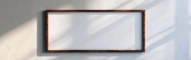 Empty Wooden Frame on White Wall photo