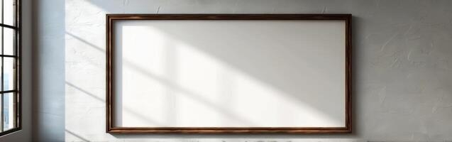 Blank Frame On Wall In Sunlight photo
