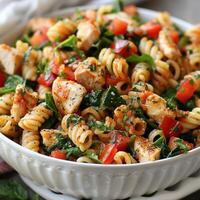Chicken Spinach Pasta Salad in a White Bowl photo