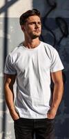 Man Wearing White T-Shirt Stands in Front of Graffiti Wall photo