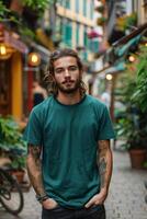 Young Man in Green T-Shirt Standing in an Alleyway photo