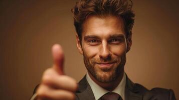 Businessman in Suit Giving Thumbs Up photo