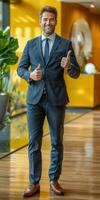 Businessman in Suit Giving Thumbs Up photo