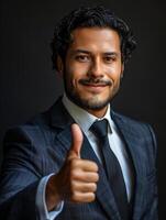 Businessman in Suit Giving Thumbs Up photo