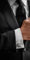 Man Adjusting Cufflinks in Suit photo