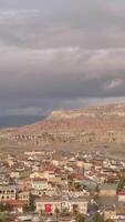 Aerial view of ancient region Cappadocia in Turkey. Action. Beautiful city on a cloudy sky background, concept of tourism and travelling. video