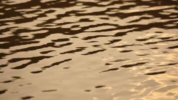 Ripples on water surface with the reflection of sky and clouds. clouds in blue sky reflect on lake, movement of wave on water surface, white fluffy clouds. Holiday, vacation and recreational concept. video