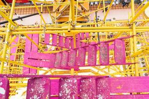 Around Phra That Doi Suthep there are many red and yellow scaffolding which is quite dusty and dirty. photo