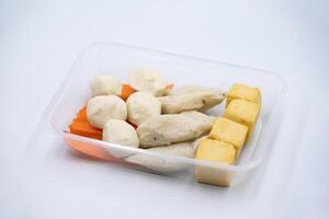 Tofu with fish, crab sticks, and meatballs They are used to make sukiyaki, which is even more delicious when served with shabu suki sauce. photo