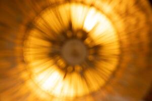 Abstract blur orange light - beam radius movement and explosion like a bomb or the other way view looks like sunflower abstract shape art. photo