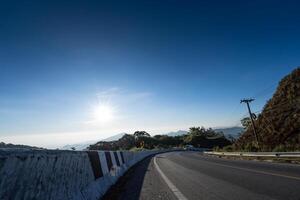 Winding road in the midst of mountain nature on the way to Doi Inthanon. Chiang Mai Province. photo