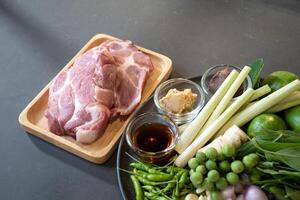 Topview of Raw Pork and herb ingredients, preparation for Cooking in Thai food menu. photo