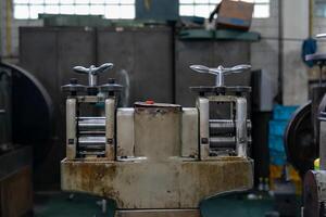 Machine and tool of Computer numerical control CNC, factory creates metal religion art such as Gold rolling machine and little jewelry in religious ceremony. photo