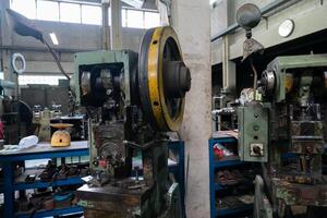 Machine and tool of Computer numerical control CNC, factory creates metal religion art such as Gold rolling machine and little jewelry in religious ceremony. photo