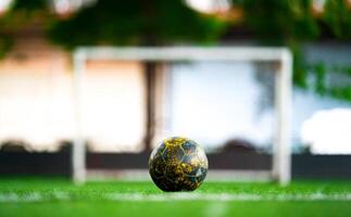 a ball in the center of the field in front of soccer goal for penalty kick. photo
