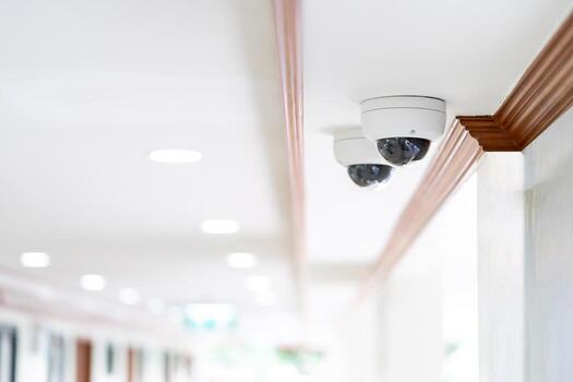 CCTV camera is installed inside the hospital building on the ceiling and wall for monitoring and running safety system control in that area. photo