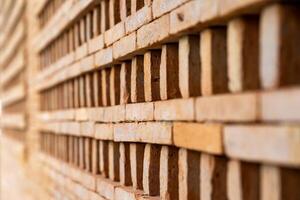 The new pattern of hole brick wall arrangement art with modern and vintage combination style for creative wall background design. photo