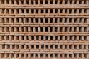 The new pattern of hole brick wall arrangement art with modern and vintage combination style for creative wall background design. photo