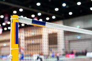 badminton net Close up shot of a used in court with blurred background in sports stadium. photo