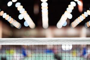 badminton net Close up shot of a used in court with blurred background in sports stadium. photo