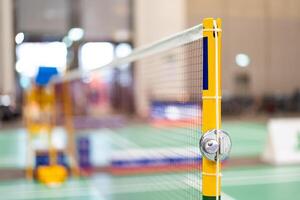 badminton net Close up shot of a used in court with blurred background in sports stadium. photo