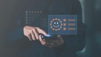Male consumers rate their satisfaction and rate and review them online. Customer Experience Survey Concepts for Services and Products and Customer Engagement photo