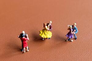 Couple dancing on a smooth brown background photo