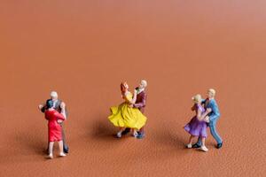 Couple dancing on a smooth brown background photo