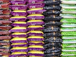a pile of sacks of rice in the shop photo