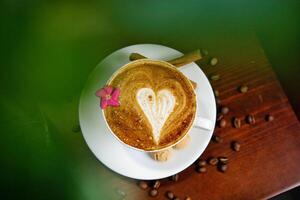 Cappuccino With Heart Design and Flower Garnish photo