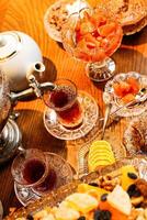 Tea and Fruit Platter on Wooden Table photo