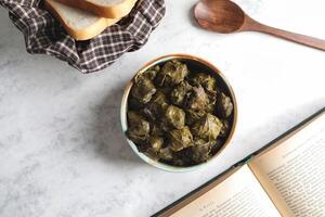 Stuffed Grape Leaves on Marble Tabletop photo