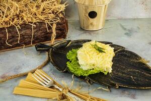 Leaf-Shaped Plate With Shredded Salad photo