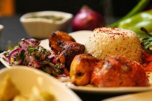 Grilled Chicken Skewers With Rice and Salad photo