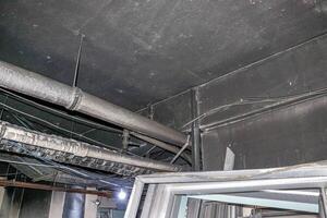 Ceiling Pipes and Wires in an Industrial Building photo