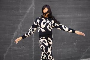 Dancer dancing in circles with energy in the street photo