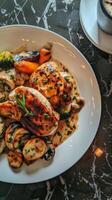 Grilled chicken breast with mushrooms and vegetables in a creamy sauce photo