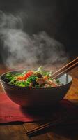 A bowl of steaming vegetables and meat photo