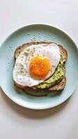 Close-up of a perfectly poached egg on avocado toast photo