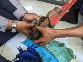 Two Men Working for remove joint connection pipe with pipe wrench. Two Men Working for remove joint connection pipe with pipe wrench. photo